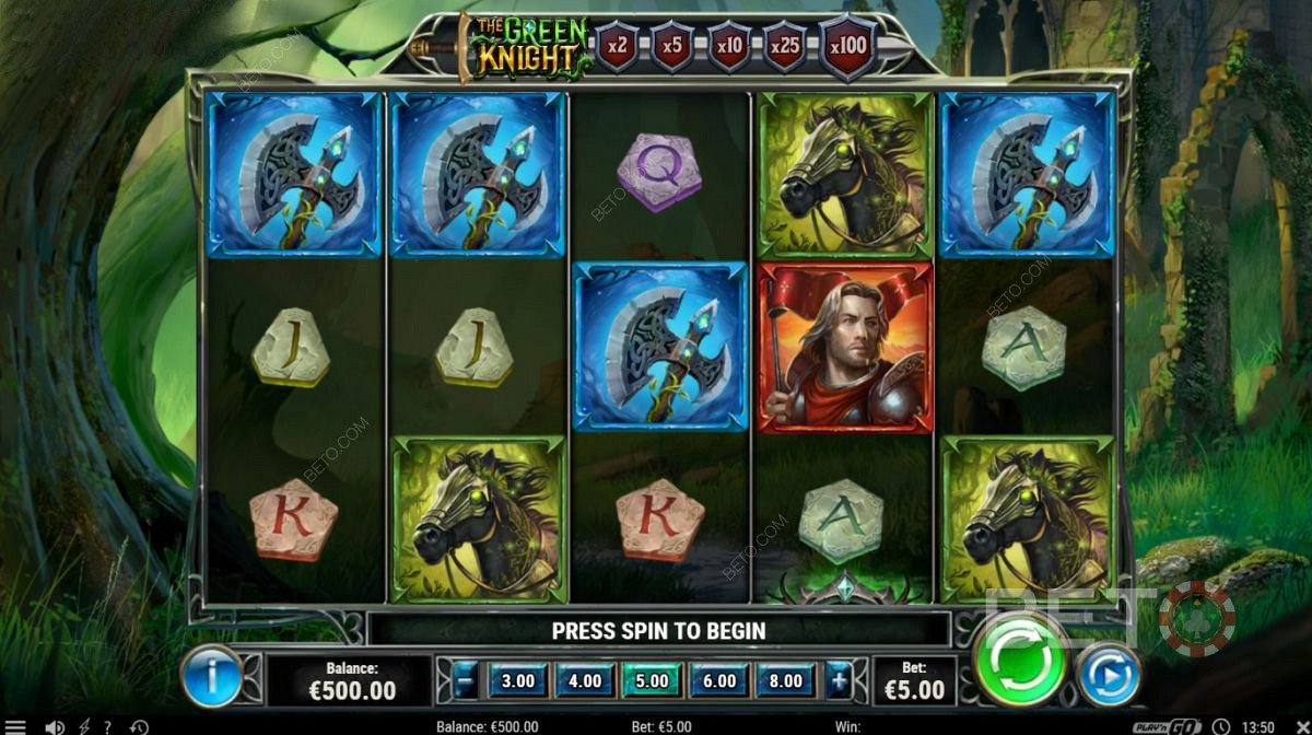 Diferentes símbolos bem pagos na slot machine The Green Knight